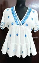 Beautiful and breezy white cotton peplum top